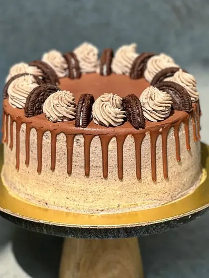 For the cookie lover, I present the 'Cookie Monster' cake. It's a vanilla Oreo cake with Oreo cream filling, an Oreo buttercream frosting, and a decadent chocolate drip.