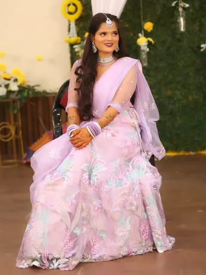 A full-length view of the bride's beautiful pastel lehenga for her sangeet.