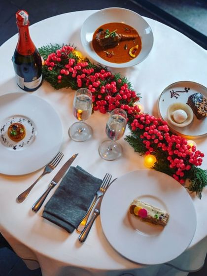 The table is set for a New Year's Eve celebration. I offer special packages that include a bottle of sparkling wine to toast to the year ahead in style.