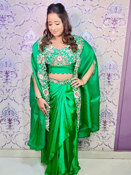 The full look, showcasing the unique drape of the saree and the elegant makeup that completes the look.