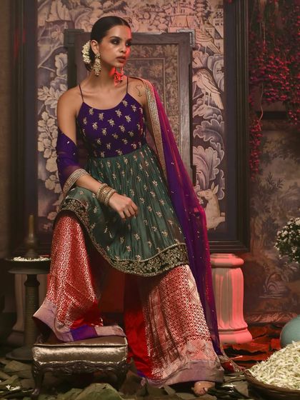 A vibrant shot showcasing a sharara set from Soho Begum. The studio's neutral walls allow bold colors to pop, making it ideal for creating eye-catching images for your fashion lookbook or social media campaign.