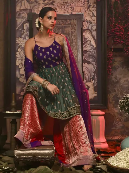 A vibrant shot showcasing a sharara set from Soho Begum. The studio's neutral walls allow bold colors to pop, making it ideal for creating eye-catching images for your fashion lookbook or social media campaign.