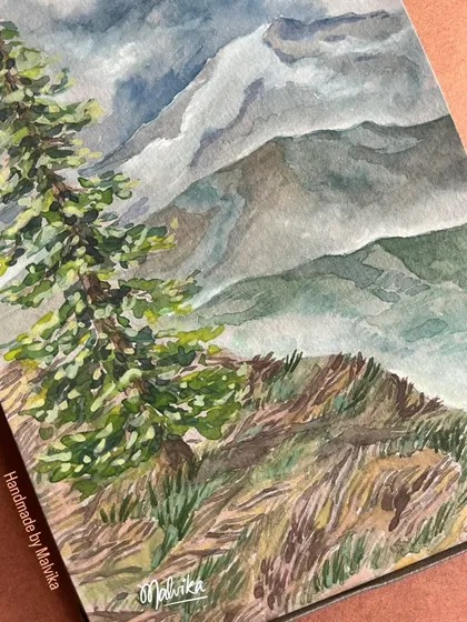 A close-up of a pine tree standing tall against a backdrop of misty mountains. This watercolor painting focuses on the textures of the foliage and the soft, moody atmosphere of a cloudy day in the hills.