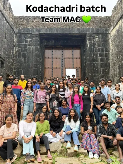 A large group from our Kodachadri batch posing in front of a historic fort-like structure on the way.