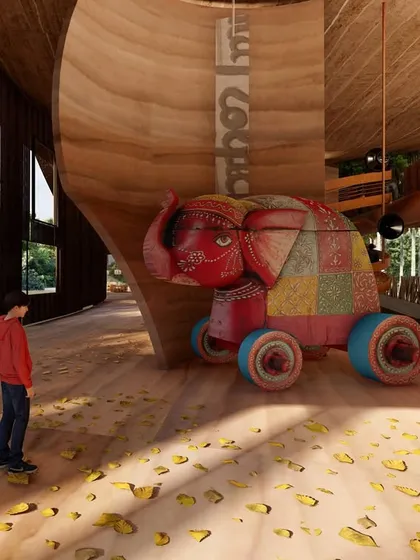 We incorporated playful elements like this large, colorful elephant toy to make the Pavilion engaging for all visitors, including children. It adds a touch of local craft and storytelling to the otherwise minimalist, material-driven interior.