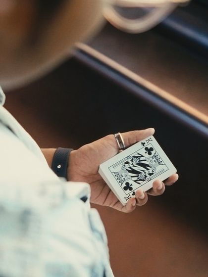A close-up shot of my hands holding a deck of cards. This is my perspective, where the magic begins.