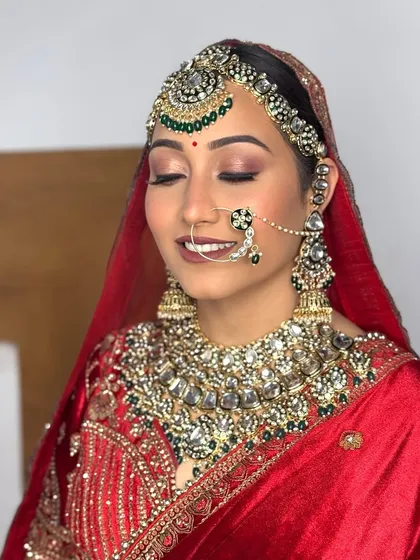 Another angle of this stunning bridal transformation, showcasing the seamless blend of makeup and the regal aura it creates.