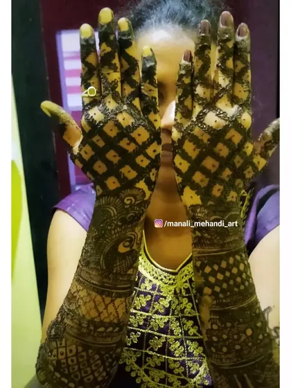 The back of the hands covered in a bold, checkered pattern. This creates a striking 'jaal' or net effect that is both traditional and eye-catching.