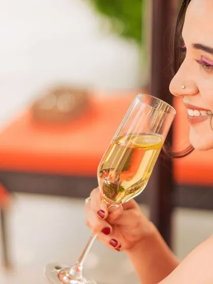 A guest enjoys a glass of champagne during our Mother's Day brunch. Our brunches are a celebration, complete with sparkling drinks and a festive atmosphere.