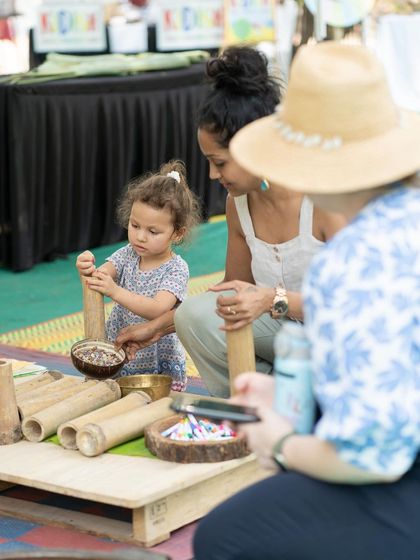 Here's another look at our nature-inspired activities. A toddler explores different textures and shapes with wooden pieces and natural elements, a simple yet powerful form of sensory learning.