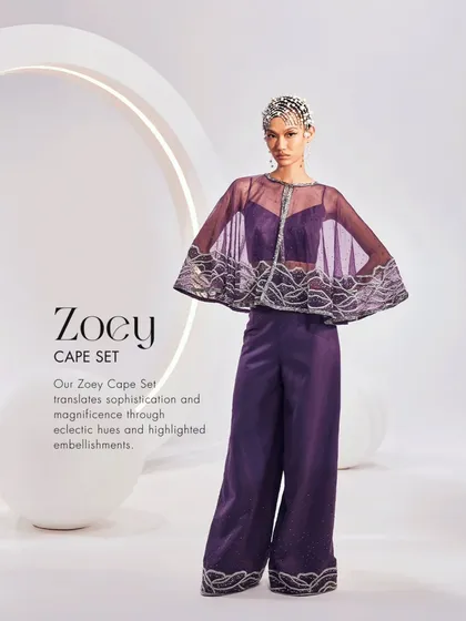 The ZOEY Cape Set translates sophistication and magnificence through eclectic hues and highlighted embellishments.