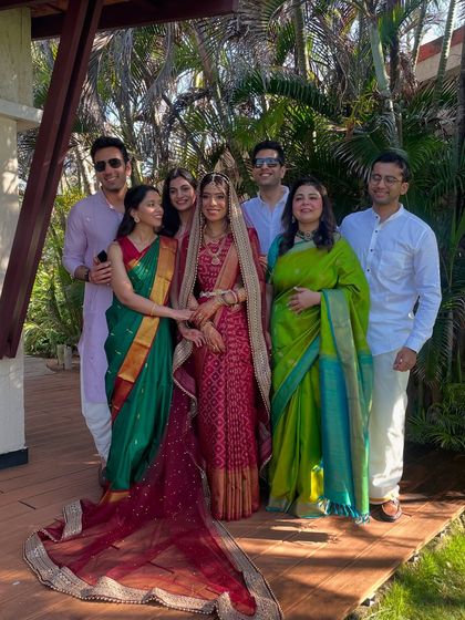 A beautiful family portrait with bride Madhumitha. I draped the sarees for the bride and the ladies in her family, ensuring everyone looked coordinated and elegant.