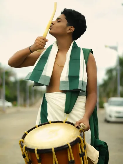 A sign of respect and love for the craft. Kissing the 'kole' or drumstick before a performance.