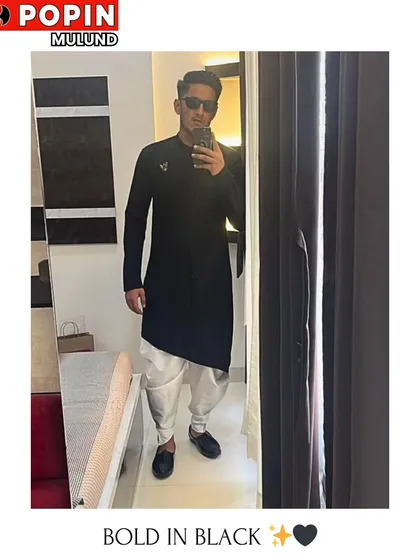 Here’s a great example of our Indo-Western collection. This client is wearing a stylish black asymmetrical kurta paired with a white dhoti, a perfect fusion look for a sangeet or mehendi.