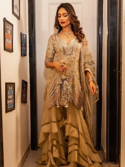 Another full-length shot of Aneri Vajani, showing how the complete makeup and hair look comes together with her stunning ethnic outfit. This is a classic example of celebrity event styling.