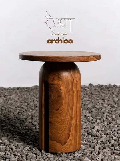 A minimalist side table crafted from a single piece of solid wood. Its simple, sculptural form and beautiful grain make it a versatile piece that can complement any modern or Japandi-inspired interior.