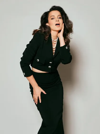For Kangana Ranaut's trailer launch, we went for a chic and powerful look. This black cropped blazer and pencil skirt co-ord set from Ritu Neeva, layered with classic pearl necklaces, is all about sophisticated power dressing for press events.