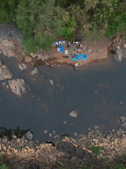 A top-down drone shot of our campsite, a tiny spot of human activity in the vast wilderness.
