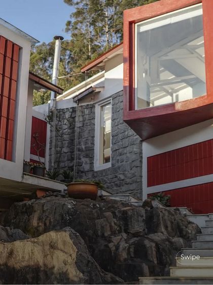 A close-up of the projecting bay window and the original rock formation it was built around, illustrating our philosophy of working with the land.