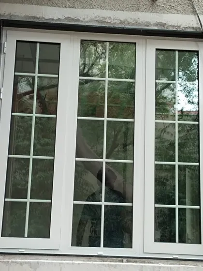 A classic white casement window with a traditional Georgian bar grid. This style is perfect for adding a colonial or farmhouse charm to any home.