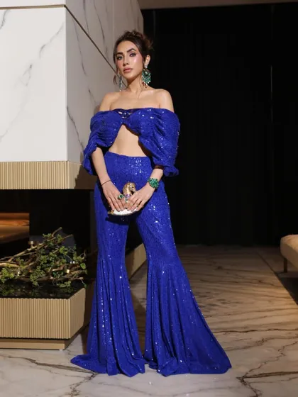 A client turns heads in this vibrant active blue sharara and off-shoulder top, a flawless blend of tradition and modern chic.