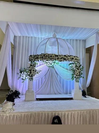 While we specialize in weddings, we also provide decorations for other important celebrations. This is an elegant all-white mandap we created for a Ganesh Chaturthi festival.