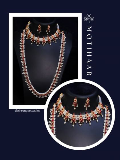 A classic Motihaar set with red stones and pearls, including a choker and a matching long necklace.