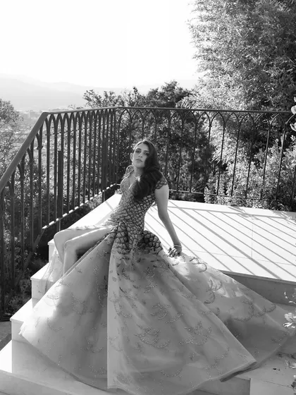 A dramatic black and white photo of the Versace gown, emphasizing its texture and timeless glamour.