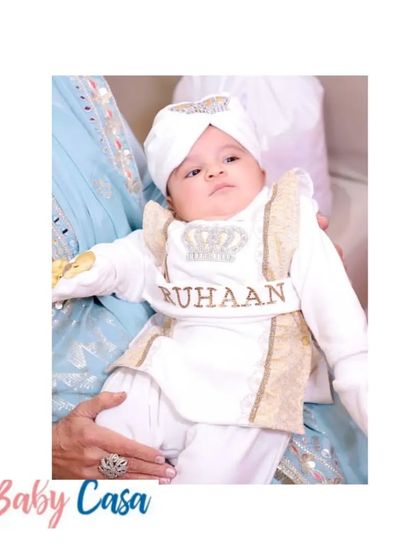 A close-up of our custom Lohri outfit for baby Ruhaan. The personalized belt and crown detail on the turban add a royal touch to his first festival look.