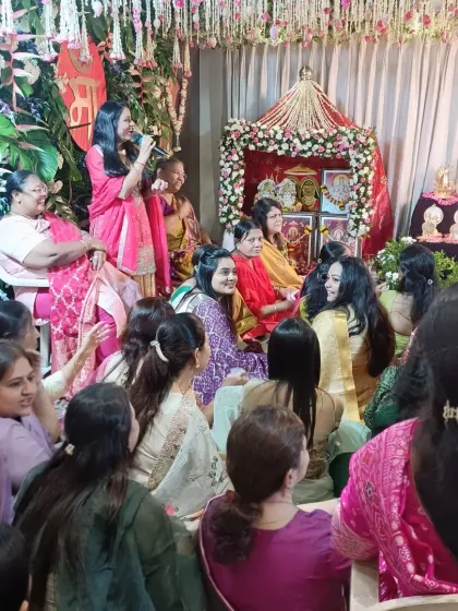 An intimate moment during a Simant ceremony, where I'm interacting with the guests. My role is to ensure everyone feels connected, making the event a shared experience of joy and blessings.