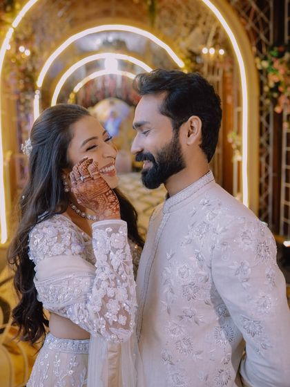 A joyful and candid portrait of the couple sharing a laugh. We believe the best portraits are the ones that capture your natural chemistry and happiness.