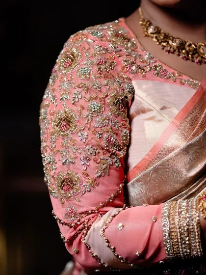 The magic is in the details. This is a close-up of a hand-embroidered peach organza blouse, where every bead and thread is carefully placed to create a work of art. It’s how I give a new life to a classic saree.