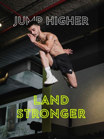 An explosive tuck jump, demonstrating the plyometric training we incorporate to build power and agility. This kind of athletic development is central to our training philosophy.