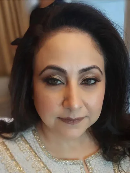 A polished and elegant makeup look for a mature client, likely the mother of the bride or groom. We used soft, neutral tones to define her eyes and create a smooth, radiant complexion.