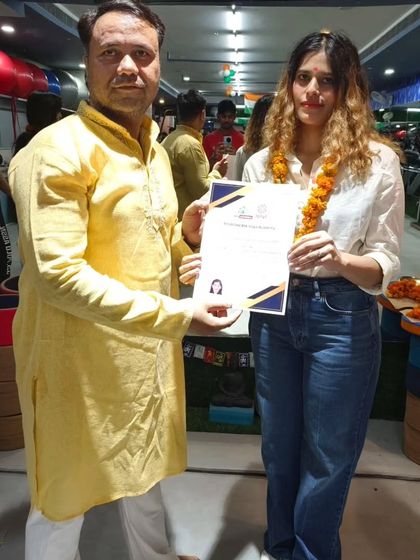 Presenting the certificate of completion to a promising new teacher. I am confident she will be a wonderful guide for her own students in the future.