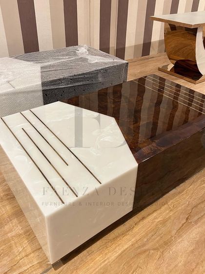 A showcase of different center table designs. This includes a piece with a white onyx top and brass inlay, and another with a dark veneer and onyx combination, highlighting my range in materials and styles.