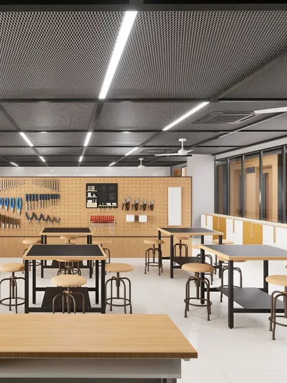 The maker's lab at Heritage Xperiential Learning School, equipped with workbenches and a tool wall. We design these spaces to facilitate hands-on exploration and project-based learning.