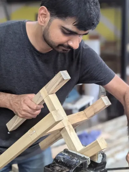 A participant inspecting his hand-cut joinery. There's a huge sense of accomplishment in seeing two pieces of wood fit together perfectly because of the skill in your own hands.