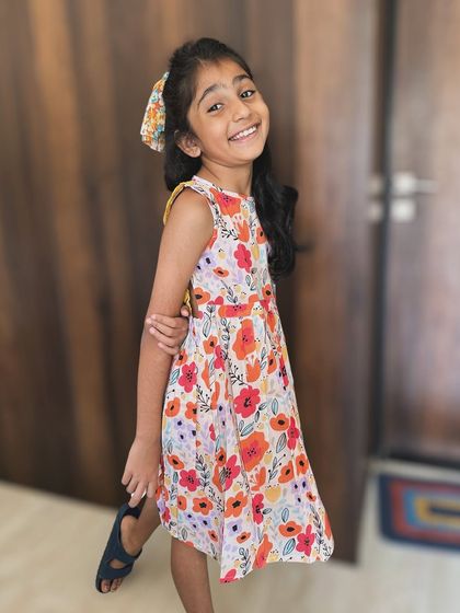 That smile says it all! Our floral backless frock is designed for comfort and endless smiles, perfect for a picnic in the park or a day of exploring.