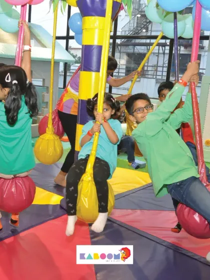Swinging with friends on the merry-go-round. It's a whirlwind of fun!