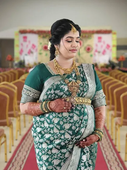 A quiet moment of reflection for this mom-to-be. Her hands, adorned with my henna, rest on her baby bump, symbolizing the deep connection between mother and child.