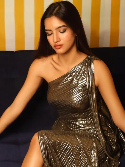 A seated pose that creates a soft, elegant mood. The different colored backgrounds in the studio allow for a variety of looks.