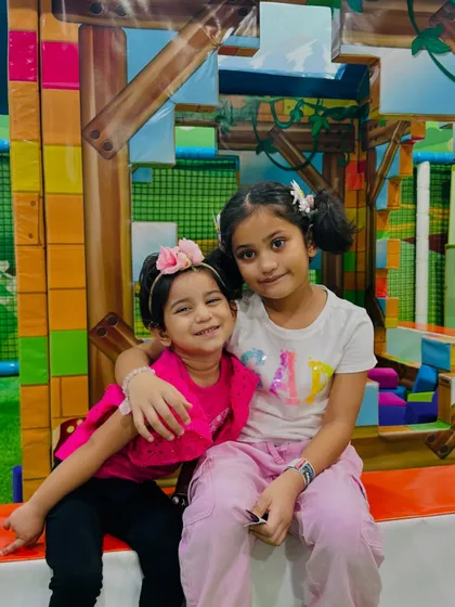 Two sisters share a sweet moment in the My Burrow area. It's a wonderful place for siblings to play together safely.