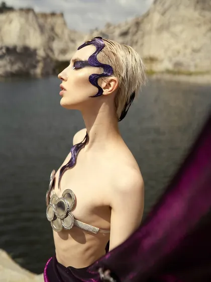 A serene, side-profile portrait from the 'Siren' shoot, focusing on the clean lines of the hair sculpture against the skin.