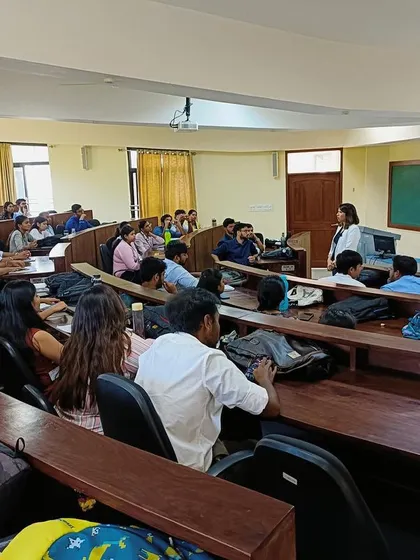 Teaching a session on the importance of business etiquette to a lecture hall full of students. Understanding professional norms is a critical part of making a great first impression in the corporate world.