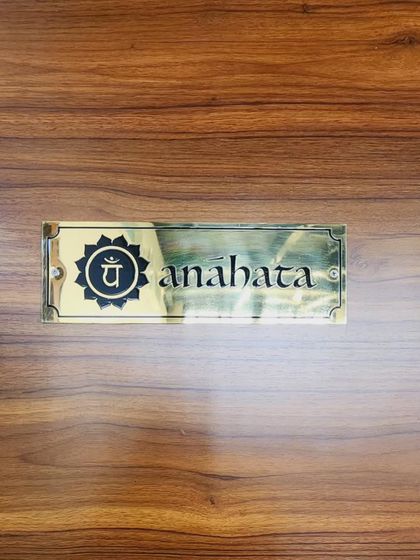 The nameplate for our Anahata studio. Anahata, the heart chakra, represents love, compassion, and connection, which are central to the advanced practices and teacher trainings held here.