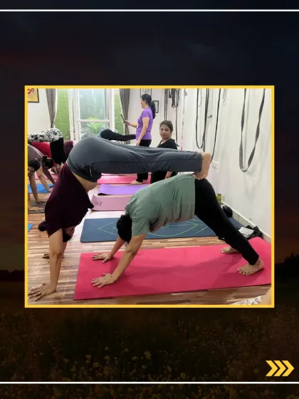 This challenging acro pose involves one person holding a handstand while supported by their partner in a downward dog position.