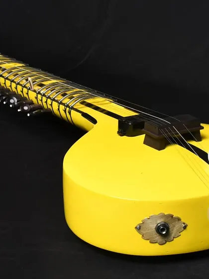 A studio shot of our bright yellow Zitar. This instrument makes a strong visual statement on any stage.