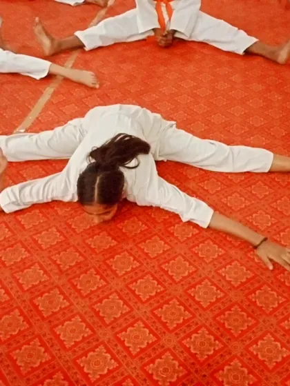 This young girl's split is perfect. Her hard work in stretching is clearly visible.
