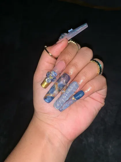 Another view of the intricate water-themed nail art, showing the detail and craftsmanship.
